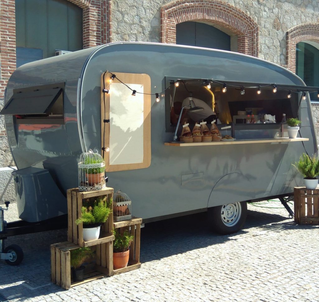 Pretty food outlet caravan with string of lights hanging